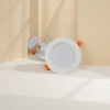 White circular LED downlight strip with orange clips and white driver power supply details Picture